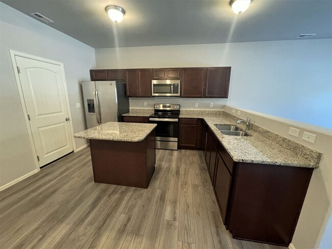 Photo - Townhome w/ 2 car garage, A/C-Newer, Low Maintance, & Conviniently Located