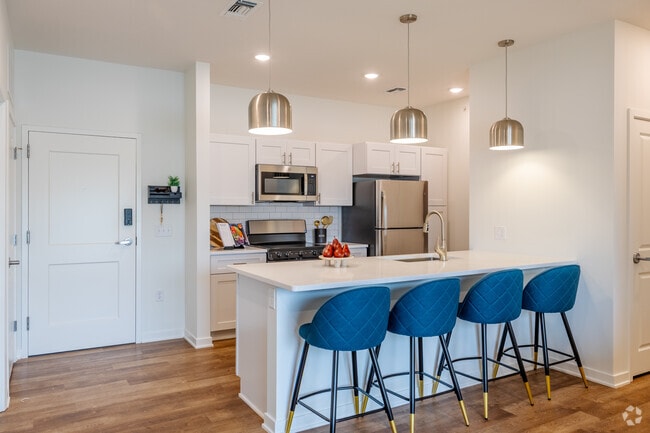 2BR, 2BA - 1,050SF - Kitchen and Dining Area