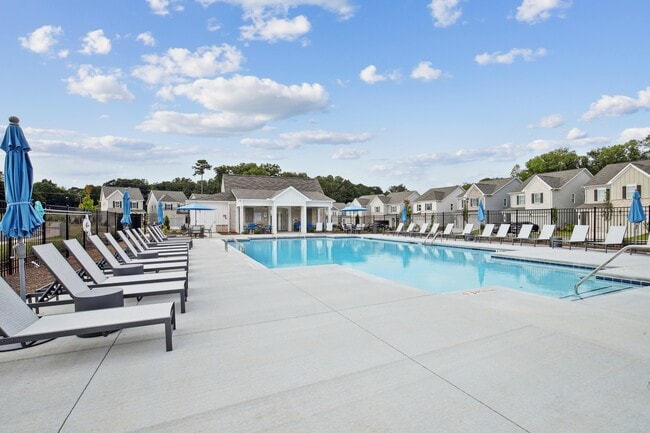 Luxurious poolside retreat with elegant seating.