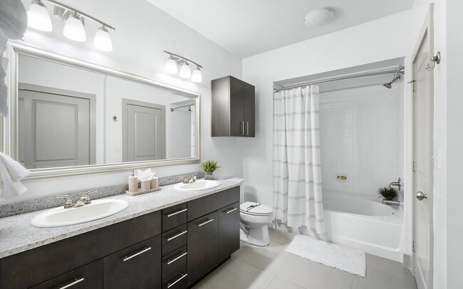 Spacious Bathroom with Double Vanities - The Landing at Vinnin Square Apartments