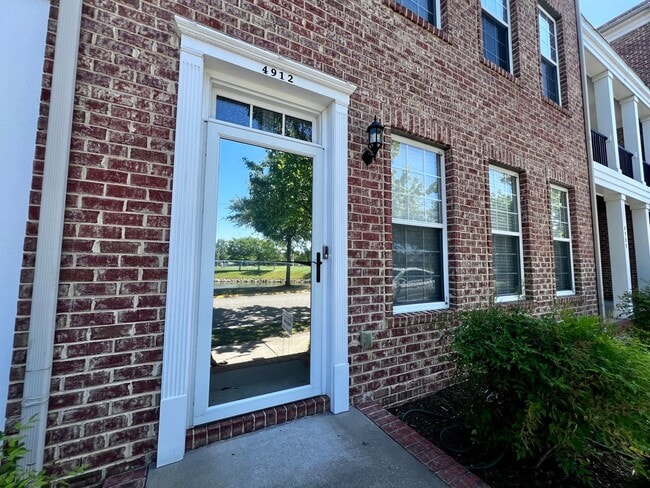 Photo - Elegant three story brick townhome with a ...