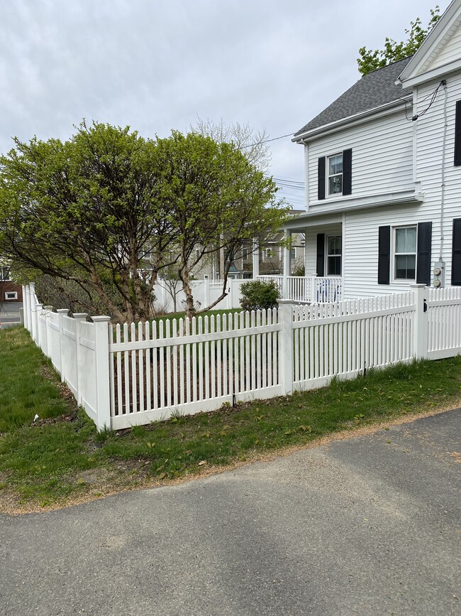 Front with fenced yard - 33 N Main St Apartments Unit 2