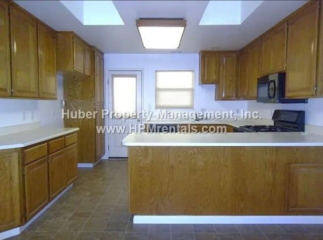 Photo - Bright Single-Story Home with Skylights, Wood Stove & Large Deck