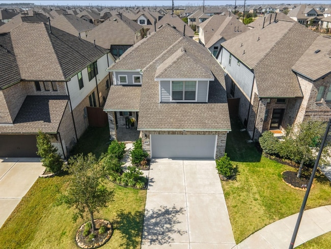Right by a cul-de-sac, this beautiful home stands out with lush landscaping and great curb appeal.