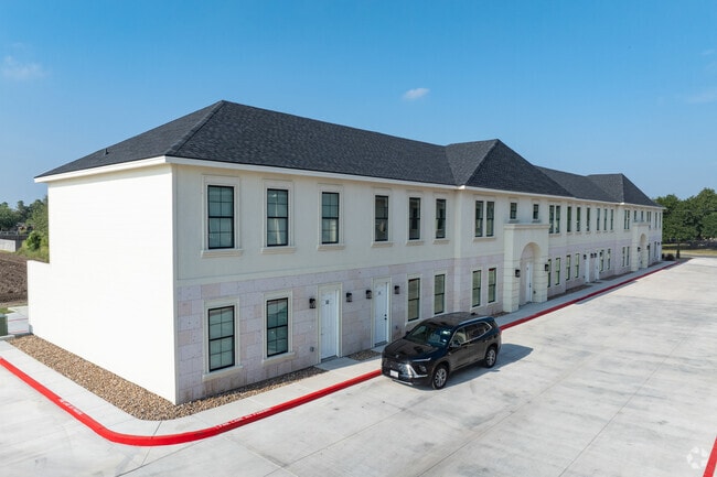 Palm Court Townhome Exterior - Palm Court Townhomes