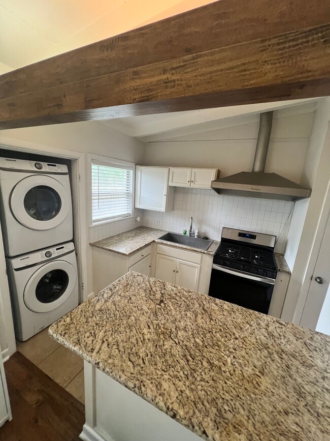 Kitchen is equipped with a brand new stainless steel gas range and refrigerator plus a pantry. - 852 Chevy Chase Dr