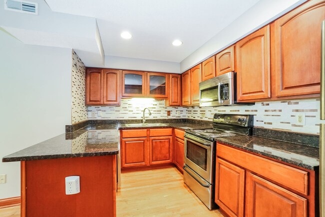 Photo - Charming 1-Bedroom Apartment with Exposed Brick, Hardwood Floors & Updated Kitchen