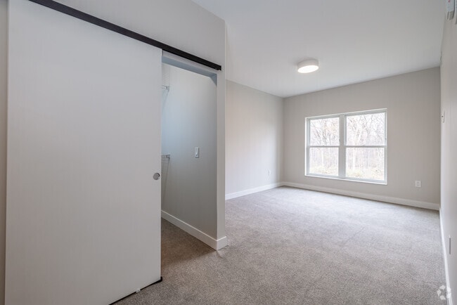 3BR, 2BA - 1,351SF - Primary Bedroom - Brightdawn Village Apartments