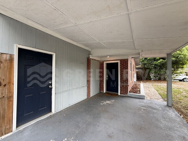 Photo - Fully Renovated 2BR Brick Home with Vaulted Ceilings & Backyard Retreat!