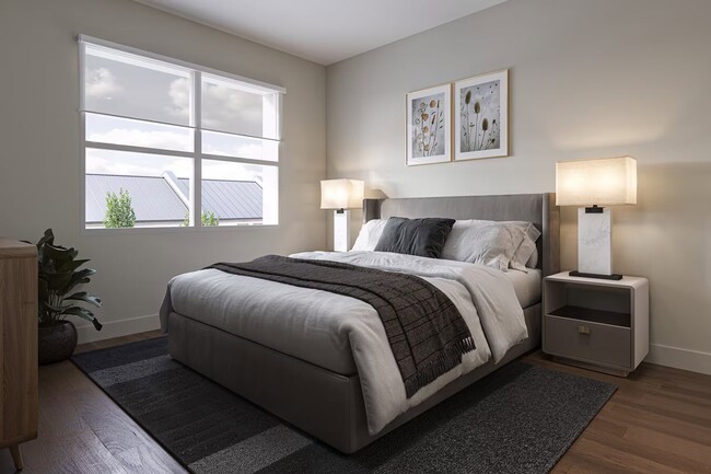 Spacious bedroom with modern finishes and large windows at Trail House.