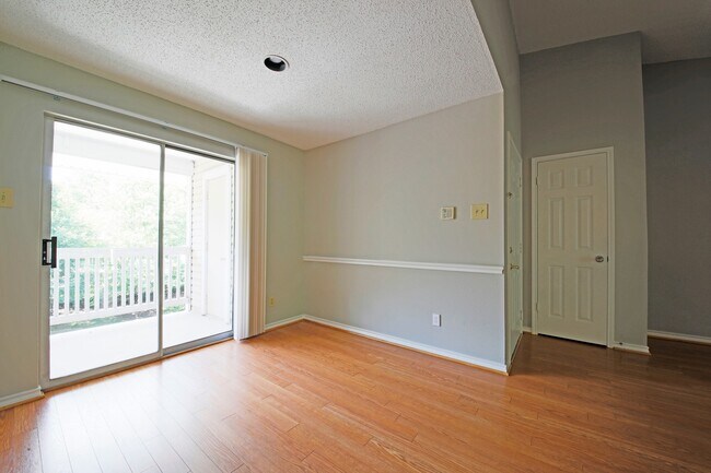 Photo - Updated top floor 2br with vaulted ceilings, two balconies and treed views! Unit 304