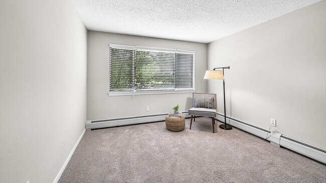 Discover comfort in our cozy bedroom, a serene haven for delightful dreams, with abundant natural light and baseboard heaters for the ultimate coziness.