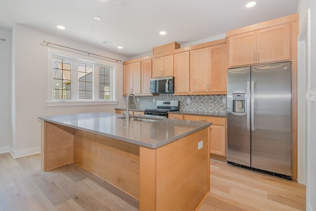 Photo - Modern 2025 Townhome | Open-Concept Living, Chef’s Kitchen with Large Island & 2-Car Garage