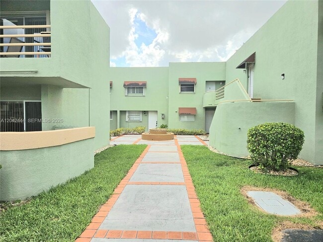 Building Photo - 11071 NW 7th St Unit 104-15