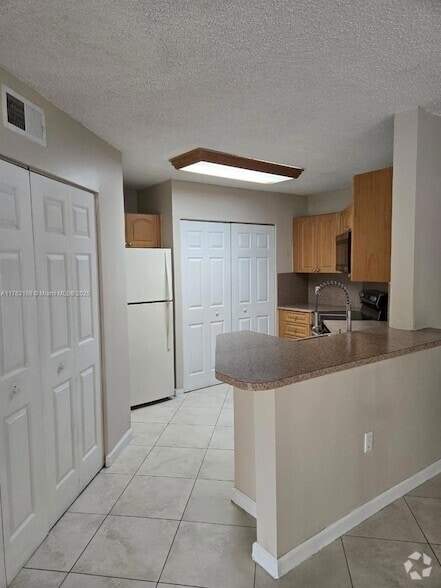 Building Photo - 6272 NW 186th St Unit 110 Rental