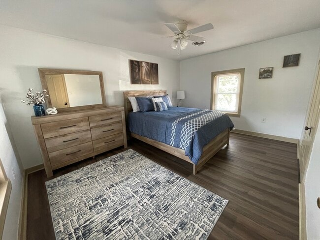Bedroom with queen bed, dresser, nightstand, and 50" TV - 2312 Old Berwick Rd Unit Upstairs