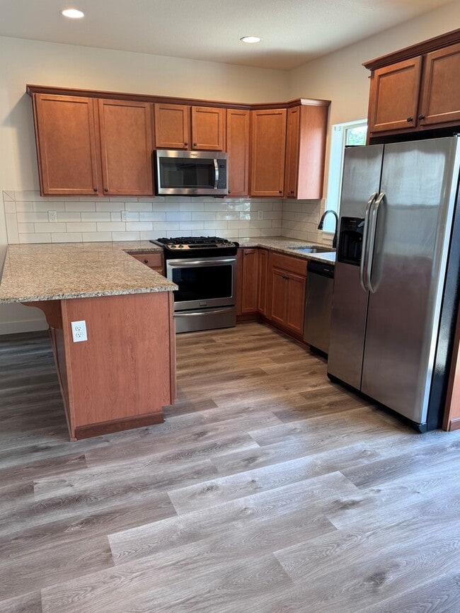 Photo - Beautiful Home with LVP Flooring, SS Appliances, Garage, W/D, Fenced Yard, LARGE Master & MORE!