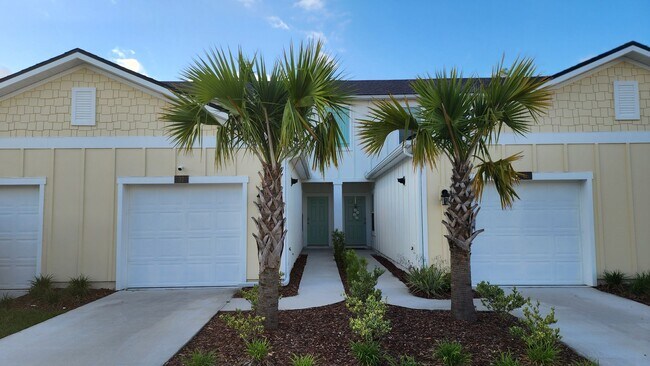 Building Photo - Beautiful Townhome in Waterford Lakes 2 Bedroom 2.5 baths and 1 Car Garage