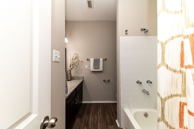 Bathroom with hardwood-style flooring