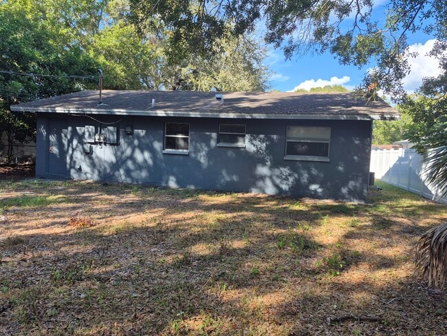 Rear of Building w/partially fenced yard - 2884 Oaklawn Ave Unit #B