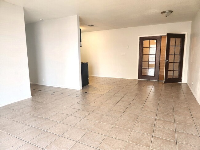 Photo - FIRST FLOOR LIVING WITH OPEN KITCHEN, DEN & CARPORT – GCU ACCESS Unit 1