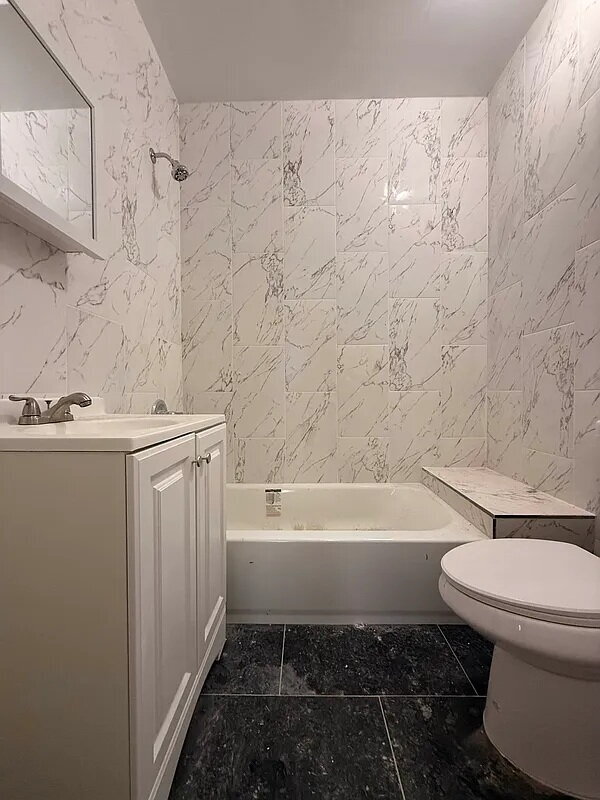 Building Photo - "Charming 1-Bedroom Furnished Apartment with Hardwood Floors in Queens – 750 Sq Ft of Comfort!"