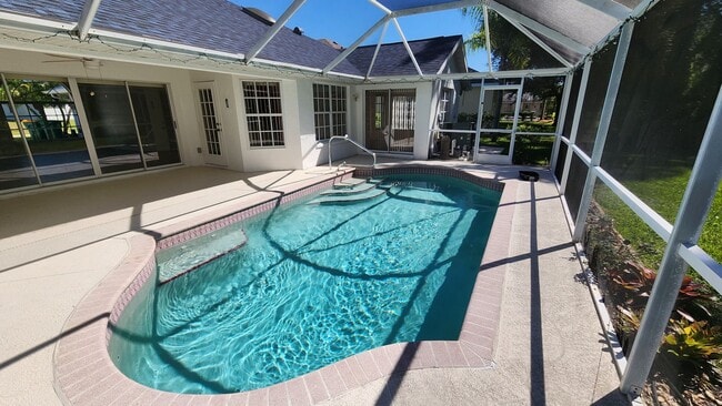Photo - Fresh Paint, New Floors, and a Heated Pool...