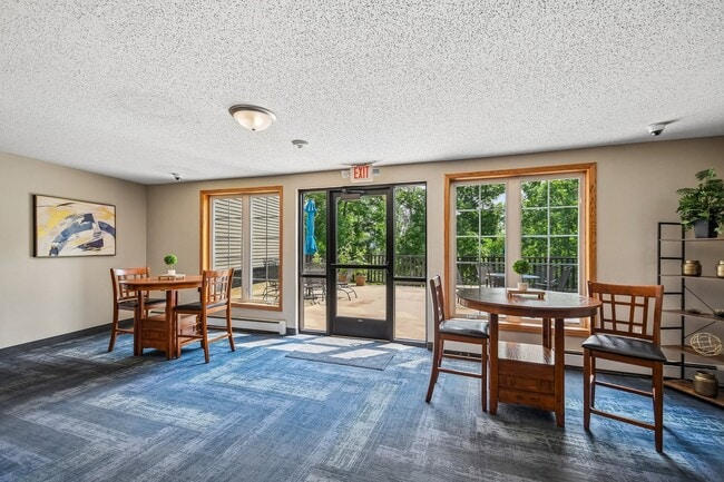 Mill Pond Apartments offers a bright and inviting common area perfect for socializing or relaxing. With large windows inviting natural light, it's an ideal spot for both work and leisure. Schedule a tour to see your new home today!