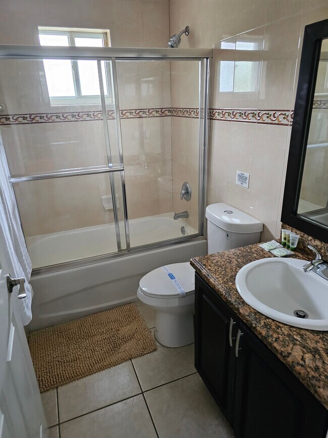 This bathroom is shared with the queen size bedroom and the full bedside bedroom - 7702 NE 3rd Ct Apartments