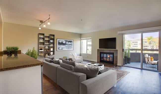 Living room comes with a fireplace and vaulted ceiling