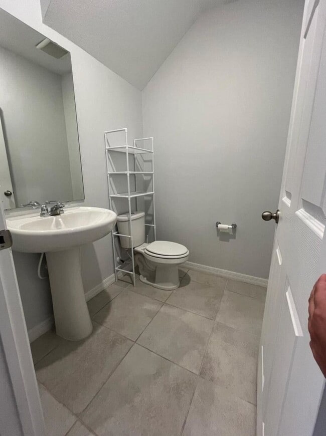 Photo - "Charming 3-Bed Townhouse with 2.5 Baths in St. Cloud's Serene Burrowing Owl Loop!"