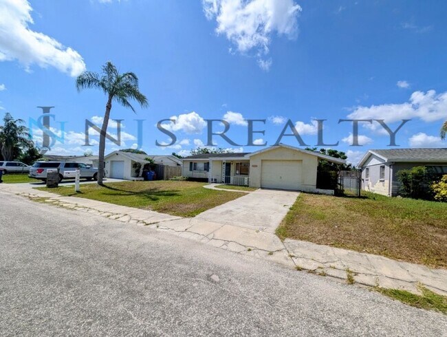 Photo - Gorgeous 3/2/1 1200 Sq. Ft. with fenced yard, all tile floors, custom baths and remodeled kitchen!!