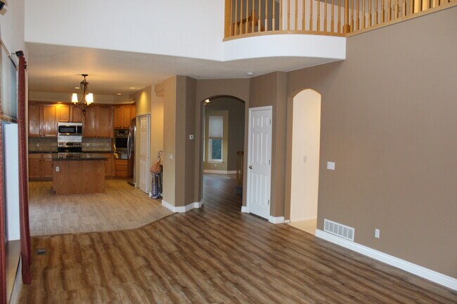 Family room - open format to kitchen, high ceilings, big windows, bright/open format - 2720 South Cole Court