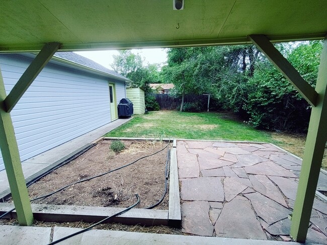 backyard with garden bed - 1611 Person Ct