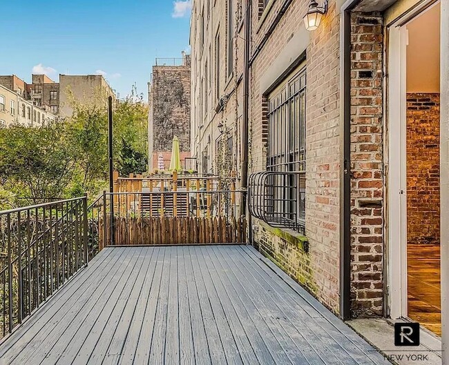 Building Photo - 533 W 149th St Unit Garden