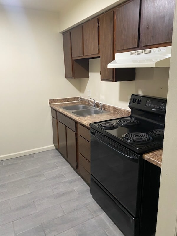 Kitchen stove and sink - Oak Forest Apartments
