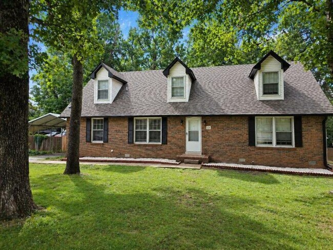 Building Photo - Welcome home to the perfect blend of peaceful country charm and modern city living!