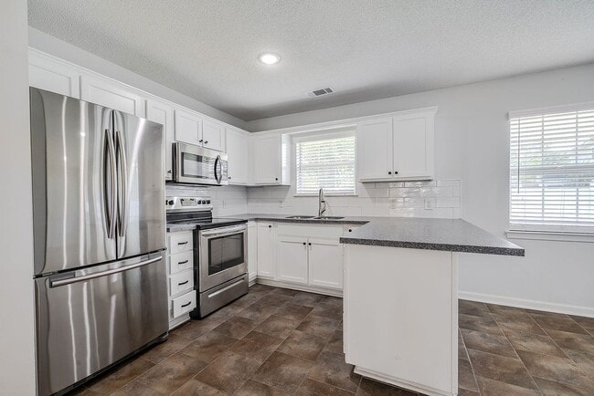 Photo - Updated 3BR Home with Fenced Yard in the H...