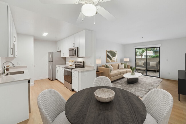 Renovated Package I kitchen, living, and dining area with hard surface flooring - Avalon Mountain View