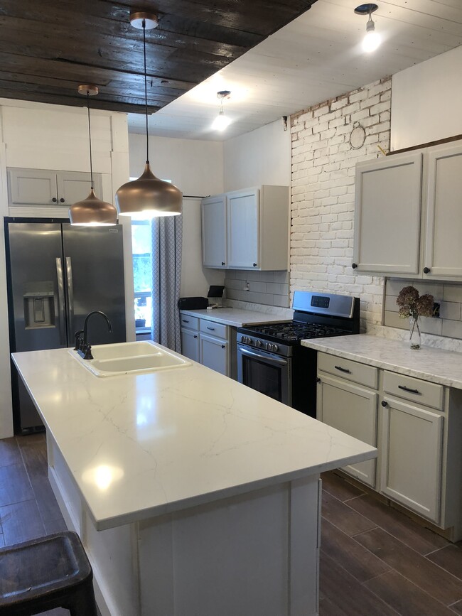 Large, new kitchen with quartz island - 764 Eastern Ave Apartments Unit 1