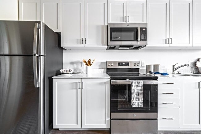 Bright kitchens featuring stainless steel appliances
