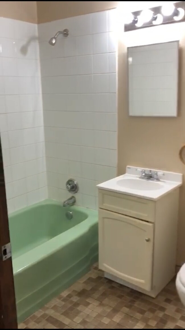 Refreshed bathroom. Example of bathroom in our 2 bedroom units. - 1338 East 7th St Apartment Unit 12