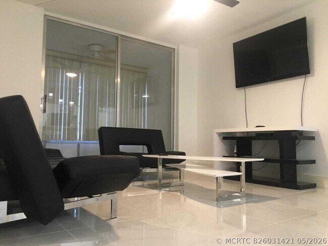 Building Photo - 9091 Lime Bay Blvd Unit 212