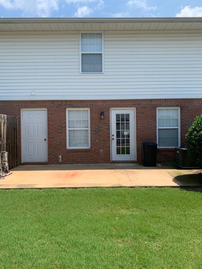 Rear patio with outside storage unit - 1477 N Donahue Dr