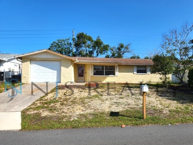Building Photo - 2/2/1 1060 Sq. Ft with INDOOR LAUNDRY, a FULL garage, and fenced in yard!!