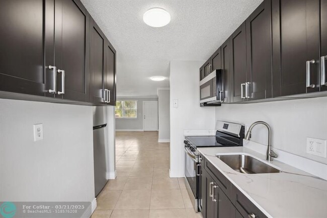 Photo - 850 E Commercial Blvd Condo Unit 214