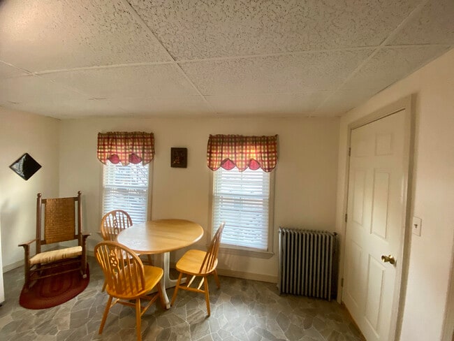 Kitchen and entrance door to apartment, area could become sitting area in the event the living room converted to bedroom. - 154 College St Unit #4