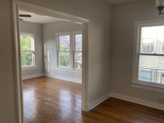 Spacious living room and dining area with loads of natural light - 266 Post Ave Apartments Unit 266 Post Ave