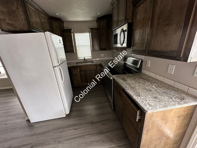 Photo - Updated and spacious 2 bedroom/1 bathroom house with detached 1 car garage. Granite countertops, ...