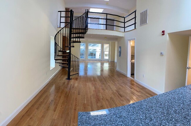 main floor, view from Kitchen - 161 Orange St Unit 3rd floor Loft
